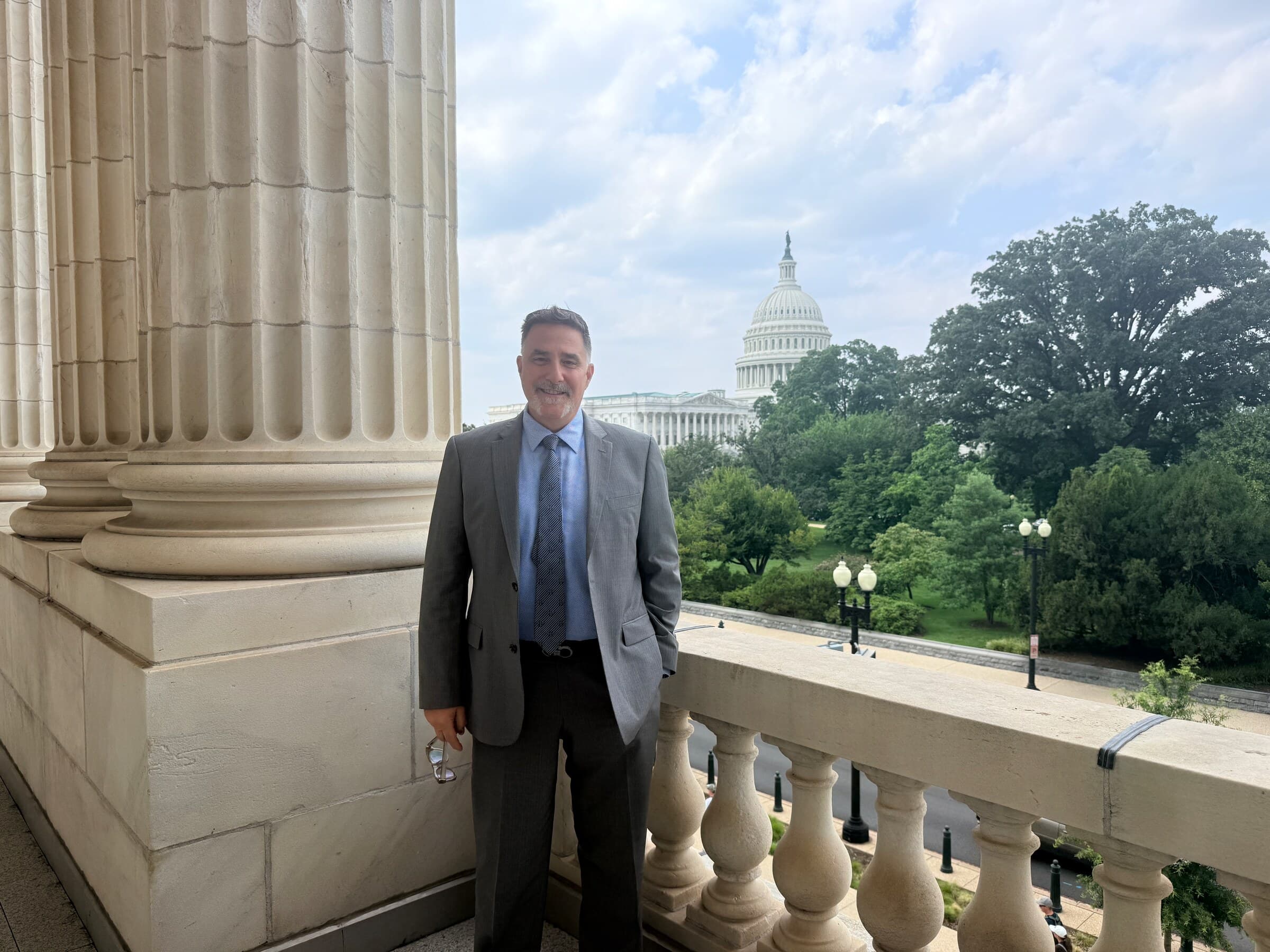 Empower Chief Growth Officer Anthony Conti with the United States Capitol in the background