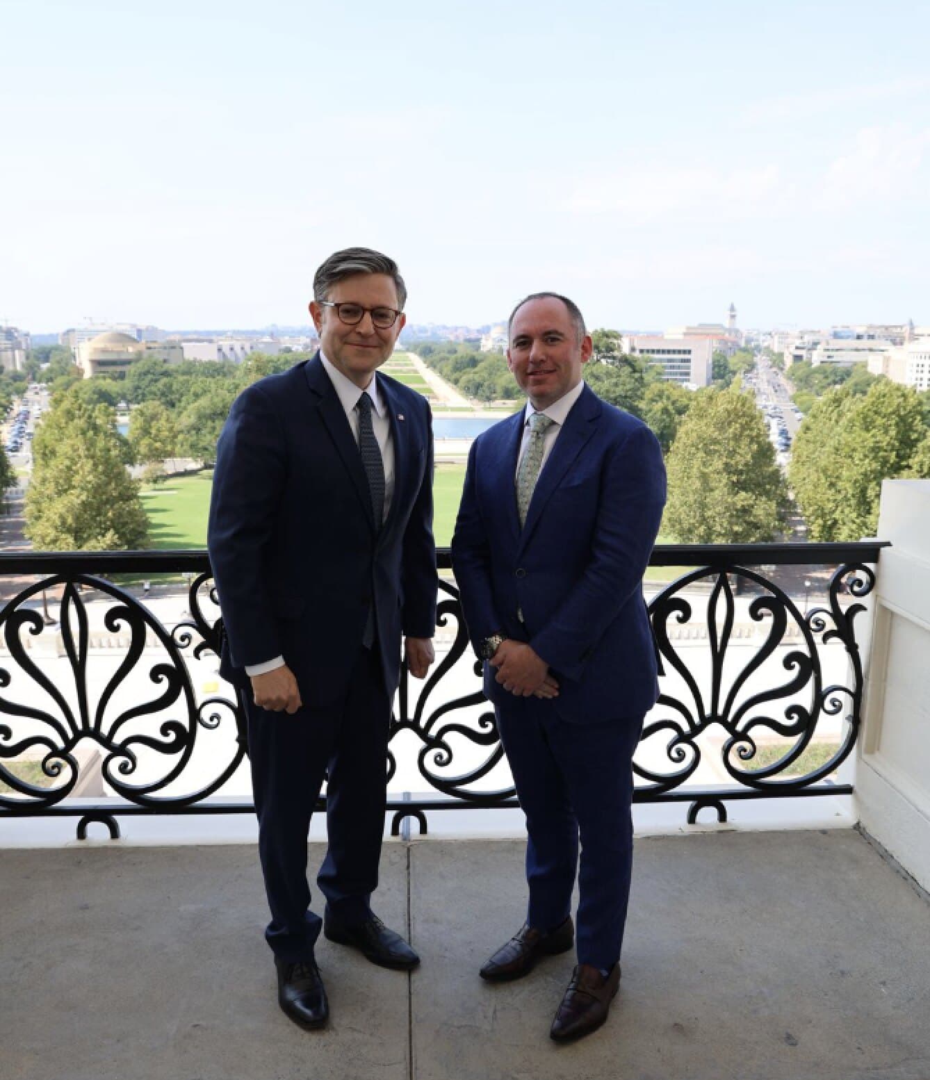 Speaker of the House Mike Johnson and Empower CEO Dr. Loeb standing together on Capitol Hill