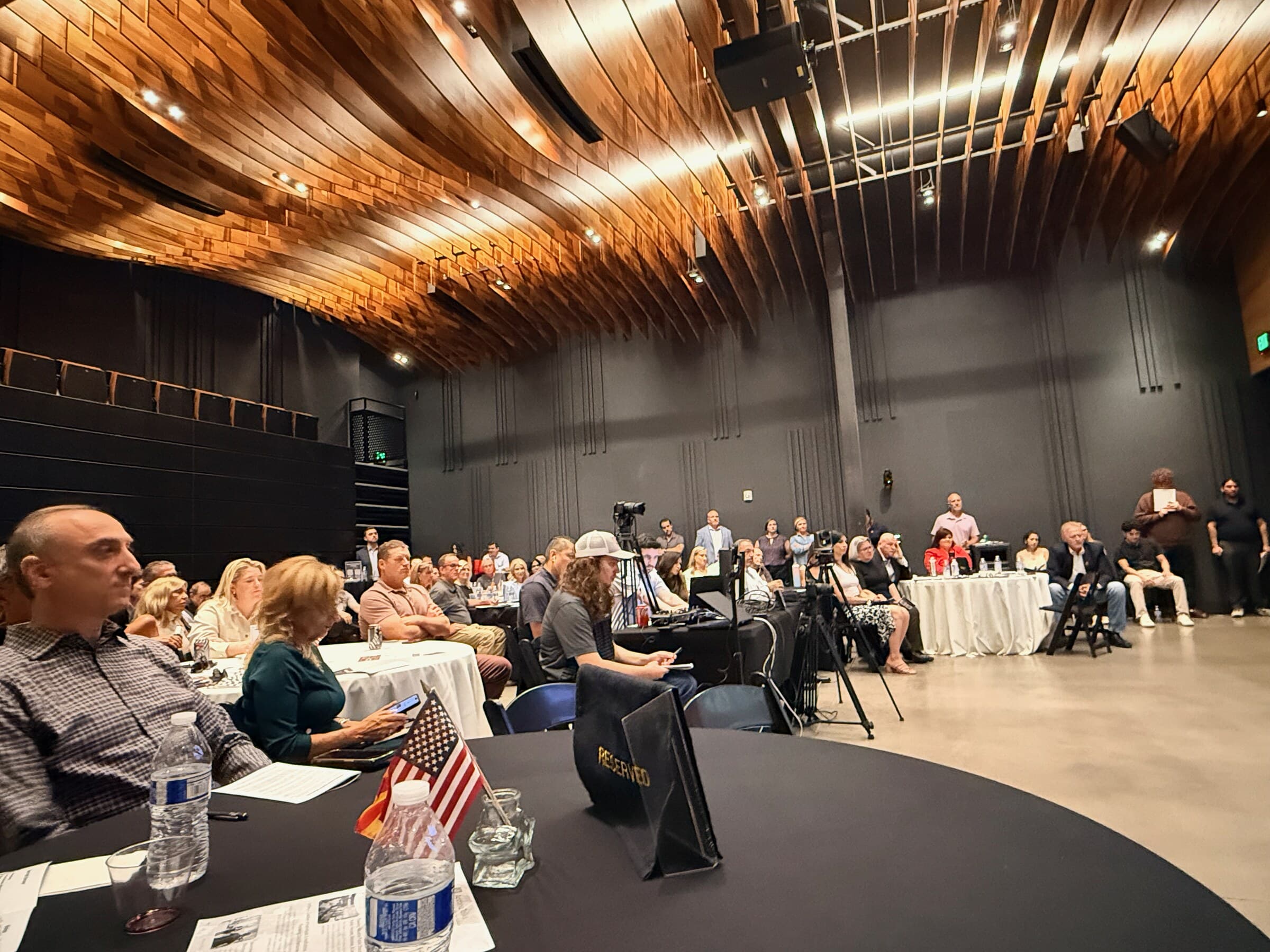 Wide view of attendees seated inside the KTAR News town hall venue