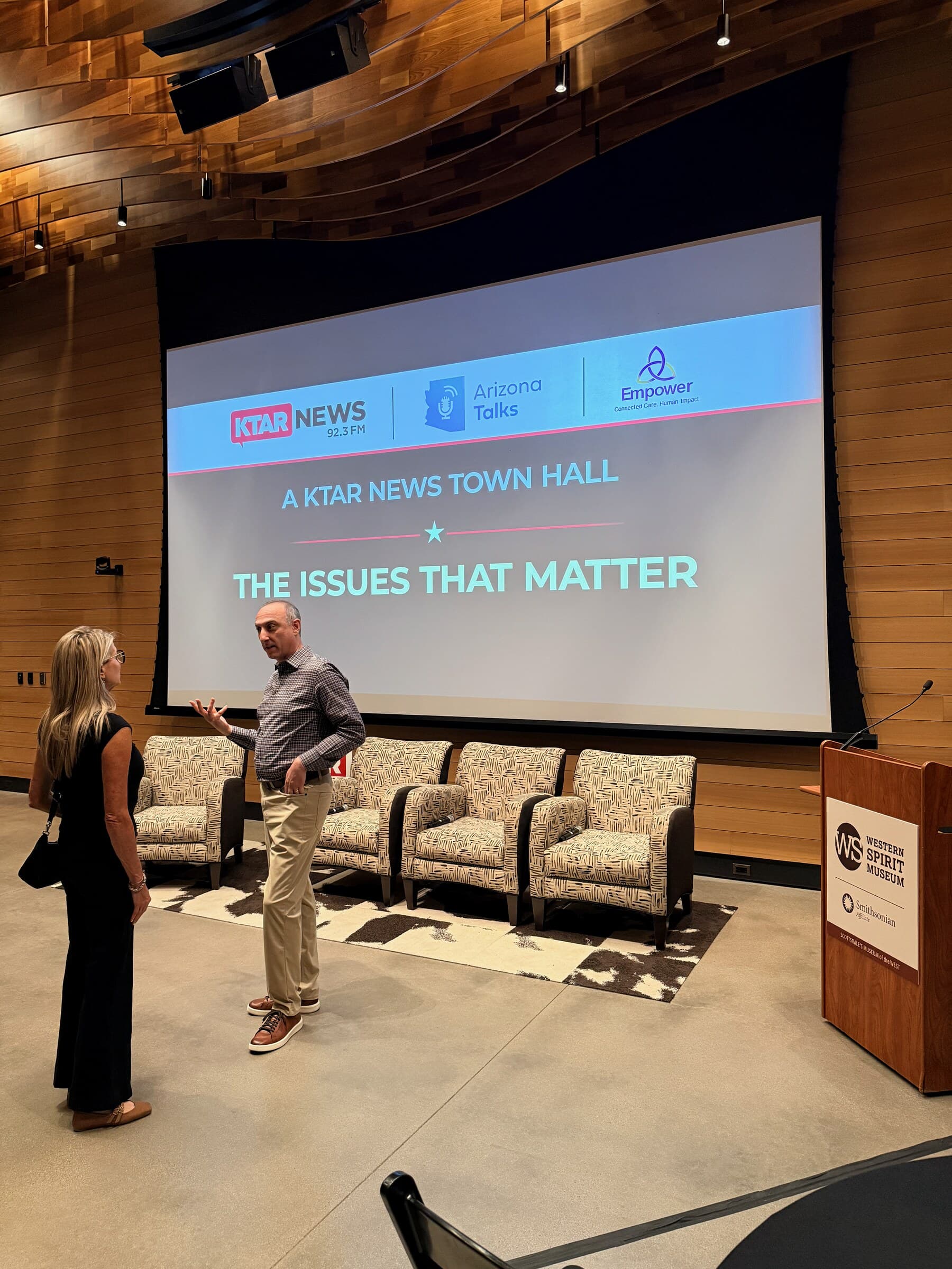 Panelists speaking onstage at The Issues That Matter town hall