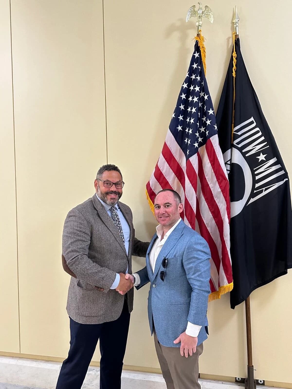 Dr. Loeb shaking hands with Gary Woodward